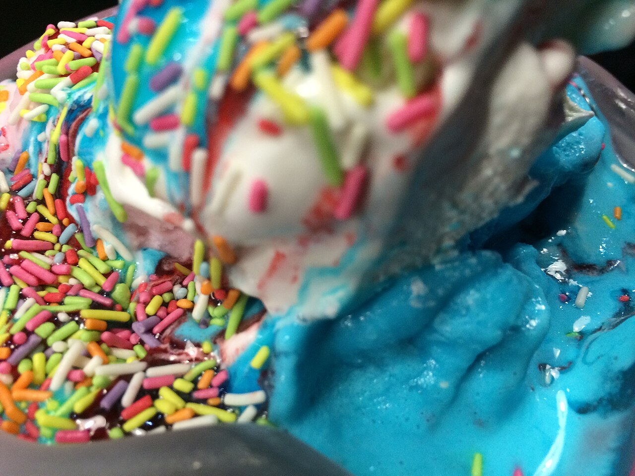 Bright blue bubblegum ice cream with sprinkles